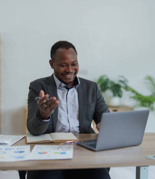 african american man, video call and laptop, wave hello and meeting, consulting or internet planning in startup company. Happy worker greeting for online meeting, computer webinar.