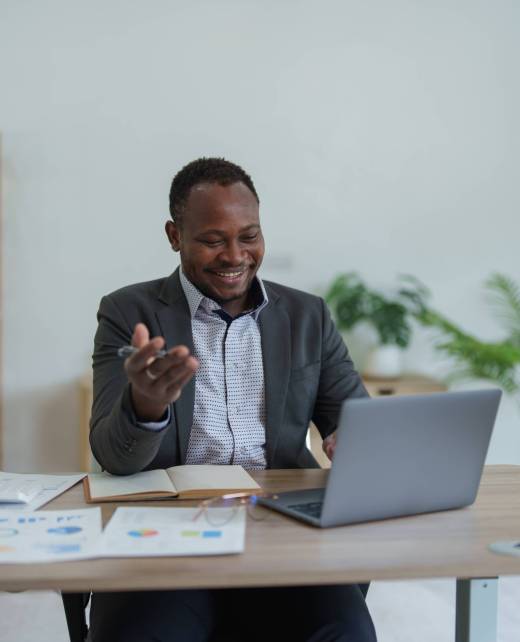 african american man, video call and laptop, wave hello and meeting, consulting or internet planning in startup company. Happy worker greeting for online meeting, computer webinar.