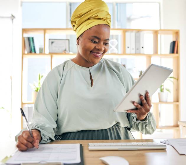 Tablet, checklist and business woman for marketing budget, report writing and online sales review i.